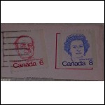 Några kanadensiska frimärken på klipp